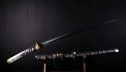 A striking samurai sword displayed against a dark background, showcasing its elegant design and detail, perfect as a 4K Ultra HD PC desktop wallpaper or background.