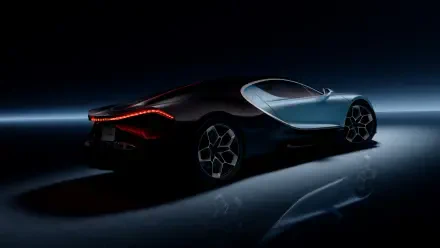 A sleek Bugatti hypercar, featuring striking lines and modern design, showcased in a dark setting with illuminated accents, perfect as a 4K Ultra HD desktop wallpaper.