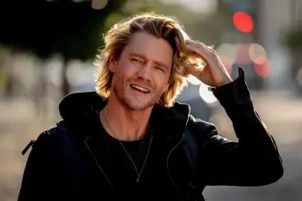 Chad Michael Murray smiles and runs his hand through his hair in this vibrant 4K Ultra HD wallpaper from the movie Freakier Friday. A lively urban background enhances the scene.