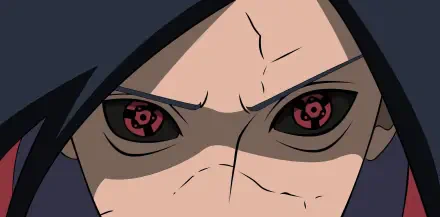 Close-up HD anime wallpaper of Madara Uchiha's intense eyes, showcasing his Mangekyō Sharingan from Naruto.