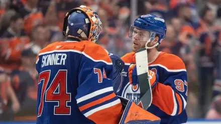 HD PC desktop wallpaper featuring Edmonton Oilers NHL players in action during an intense ice hockey game.