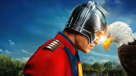4K Ultra HD PC desktop wallpaper featuring Peacemaker from DC Comics, showcasing his iconic helmet and intense gaze meeting an eagle against a vibrant sky background.