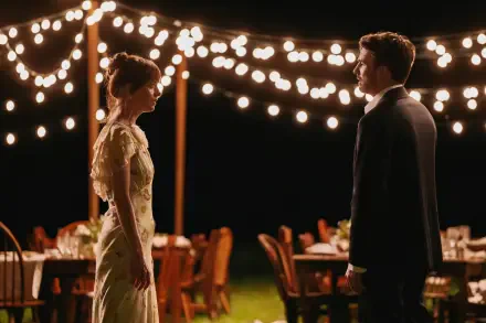 Scene from the movie Materialists featuring Dakota Johnson and Chris Evans, illuminated by string lights at an outdoor evening event, presented in 4K Ultra HD.