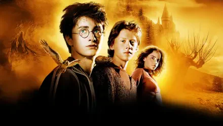 Harry Potter and the Prisoner of Azkaban 4K Ultra HD PC wallpaper: Harry, Ron and Hermione before a golden Hogwarts skyline with shadowy, looming figures.