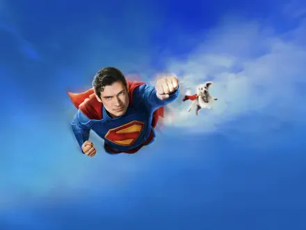 Superman (2025) flying toward the viewer with cape billowing against a vivid blue sky — 4K Ultra HD PC desktop wallpaper and background.