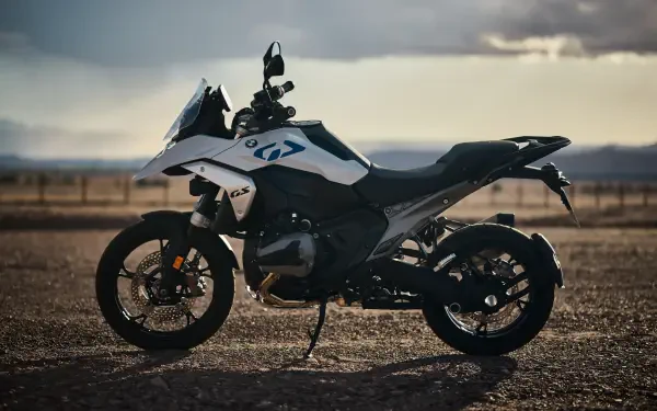 A BMW R1300GS motorcycle parked in a rugged landscape, showcased in a stunning 4K Ultra HD format, highlighting its design and features.