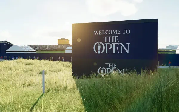 A scenic HD PC desktop wallpaper featuring a Welcome to The Open sign amidst lush grass, showcasing the vibrant environment of PGA TOUR 2K25.