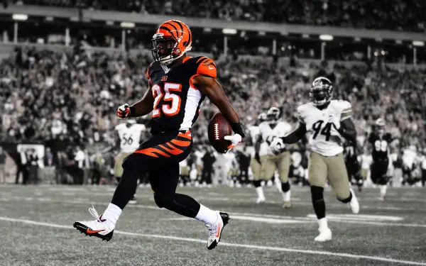 HD PC desktop wallpaper featuring a dynamic NFL football moment with a Cincinnati Bengals player in action on the field.