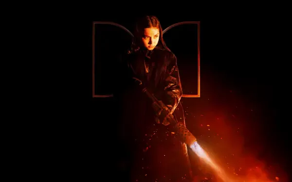 4K Ultra HD desktop wallpaper featuring Ana de Armas in a dark, intense scene from the movie Ballerina (2025) with fiery orange lighting effects.