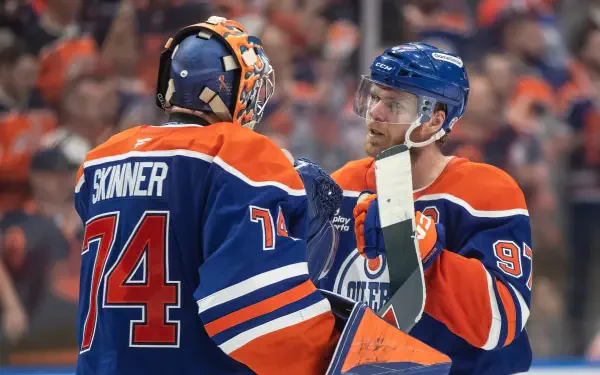 HD PC desktop wallpaper featuring Edmonton Oilers NHL players in action during an intense ice hockey game.