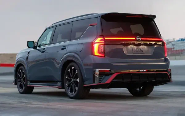 HD desktop wallpaper featuring a sleek Nissan Armada NISMO parked outdoors, showcasing its modern design and bold rear lighting.