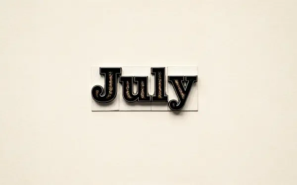 4K Ultra HD PC desktop wallpaper featuring the word July in black letterpress type on a light beige background.