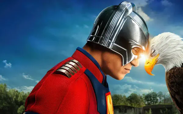 4K Ultra HD PC desktop wallpaper featuring Peacemaker from DC Comics, showcasing his iconic helmet and intense gaze meeting an eagle against a vibrant sky background.