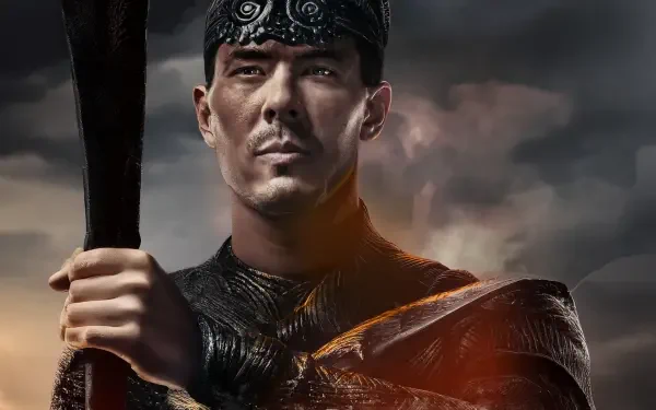 4K Ultra HD Mortal Kombat 2 (2025) PC desktop wallpaper featuring a determined warrior holding a weapon against a dramatic, cloudy background.