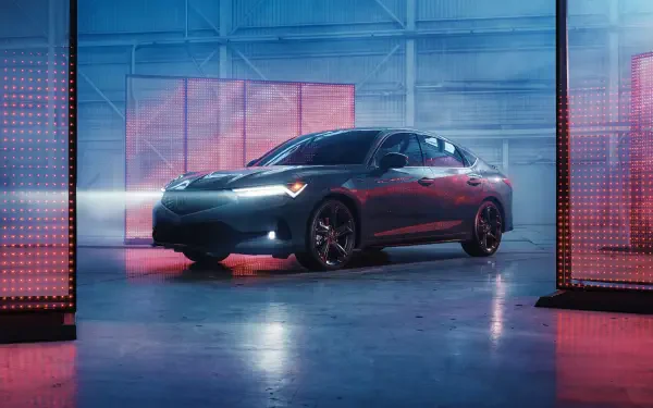 8K Ultra HD PC desktop wallpaper: Acura Integra A-Spec sedan in an industrial studio, dramatic colored lighting reflecting off its contours.