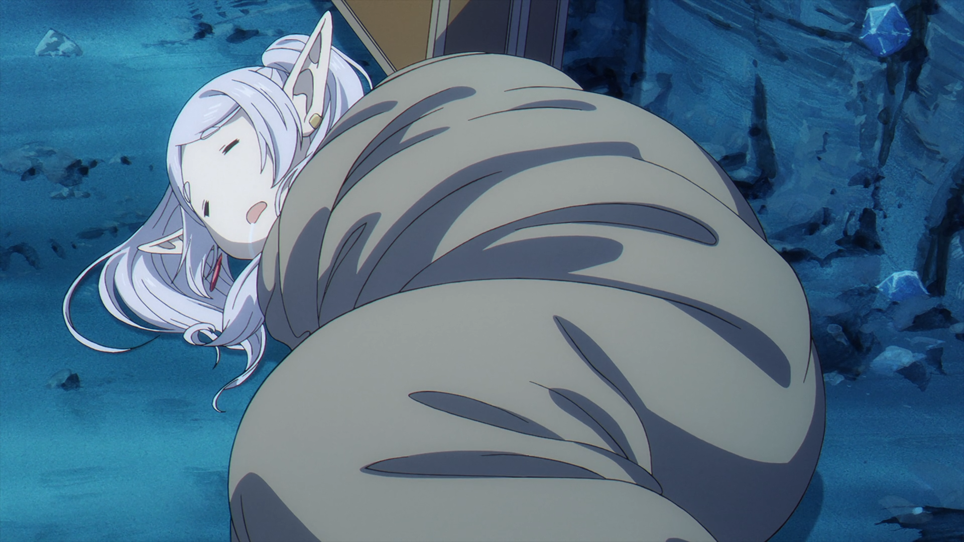 Anime HD PC wallpaper: Frieren from Frieren: Beyond Journey's End — the elf mage wrapped in a large cloak/sack, dozing against a blue rocky backdrop.