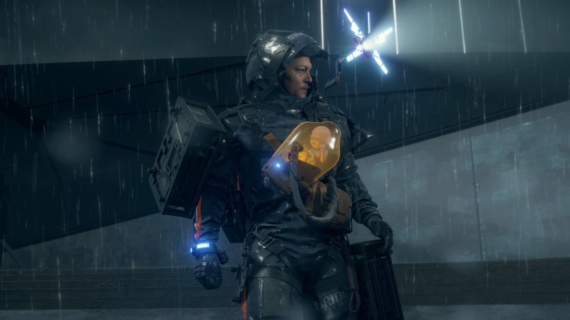 Death Stranding video game 4K Ultra HD PC desktop wallpaper: armored porter in rain carrying a baby pod, glowing BB and beacon, moody futuristic urban backdrop.