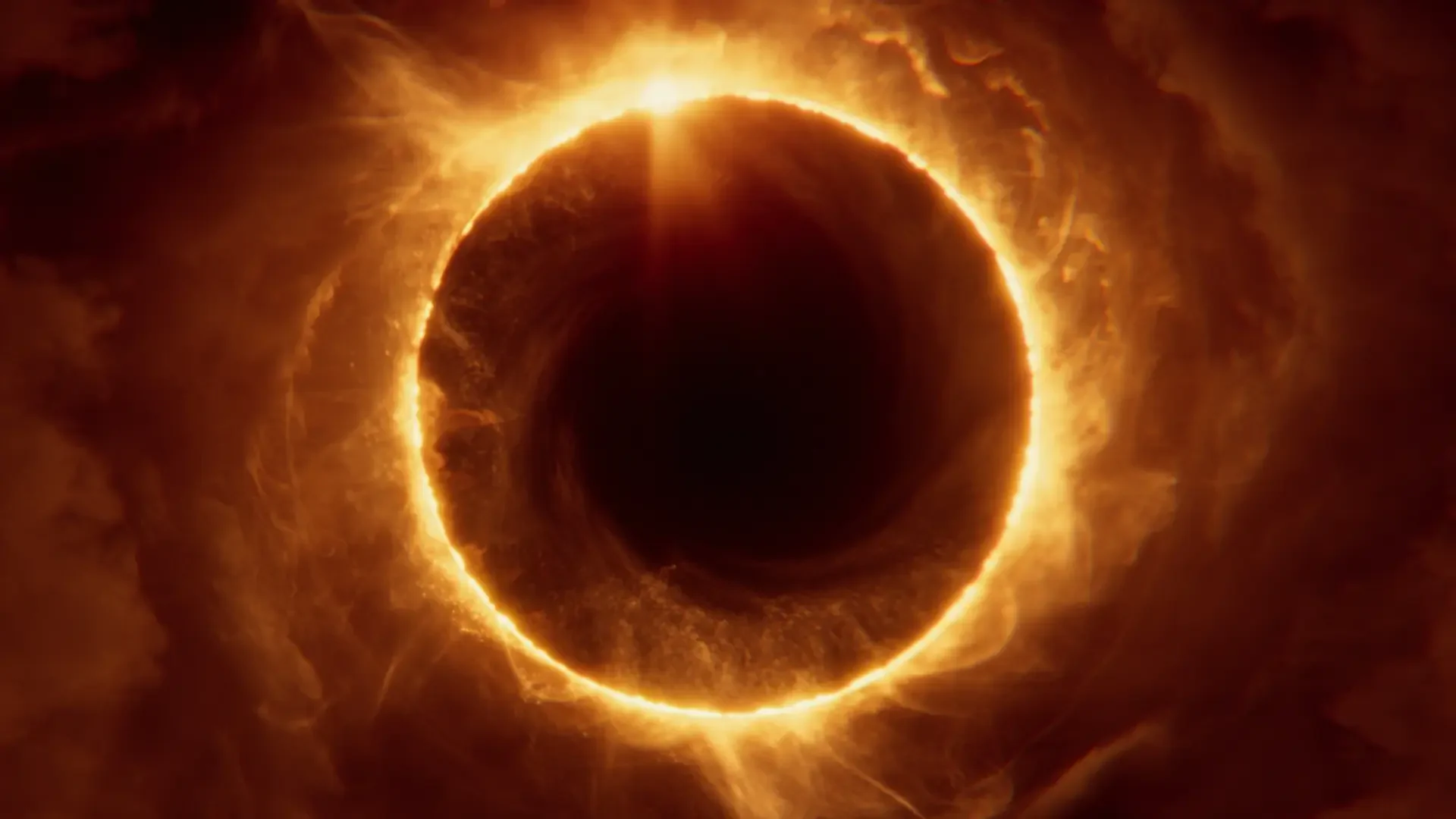 Saros video game HD PC wallpaper: fiery orange ringed eclipse — a black central void surrounded by swirling ember clouds.
