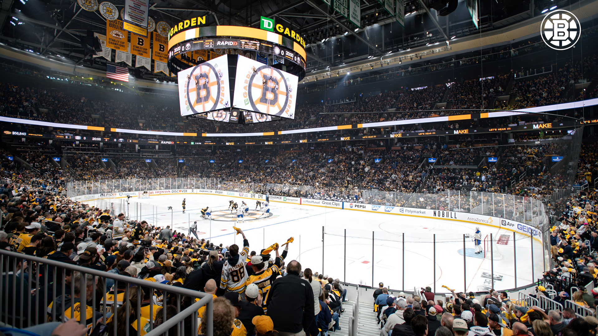 4K Ultra HD PC desktop wallpaper of an NHL hockey game at the Boston Bruins stadium, panoramic view of the ice and a packed crowd.