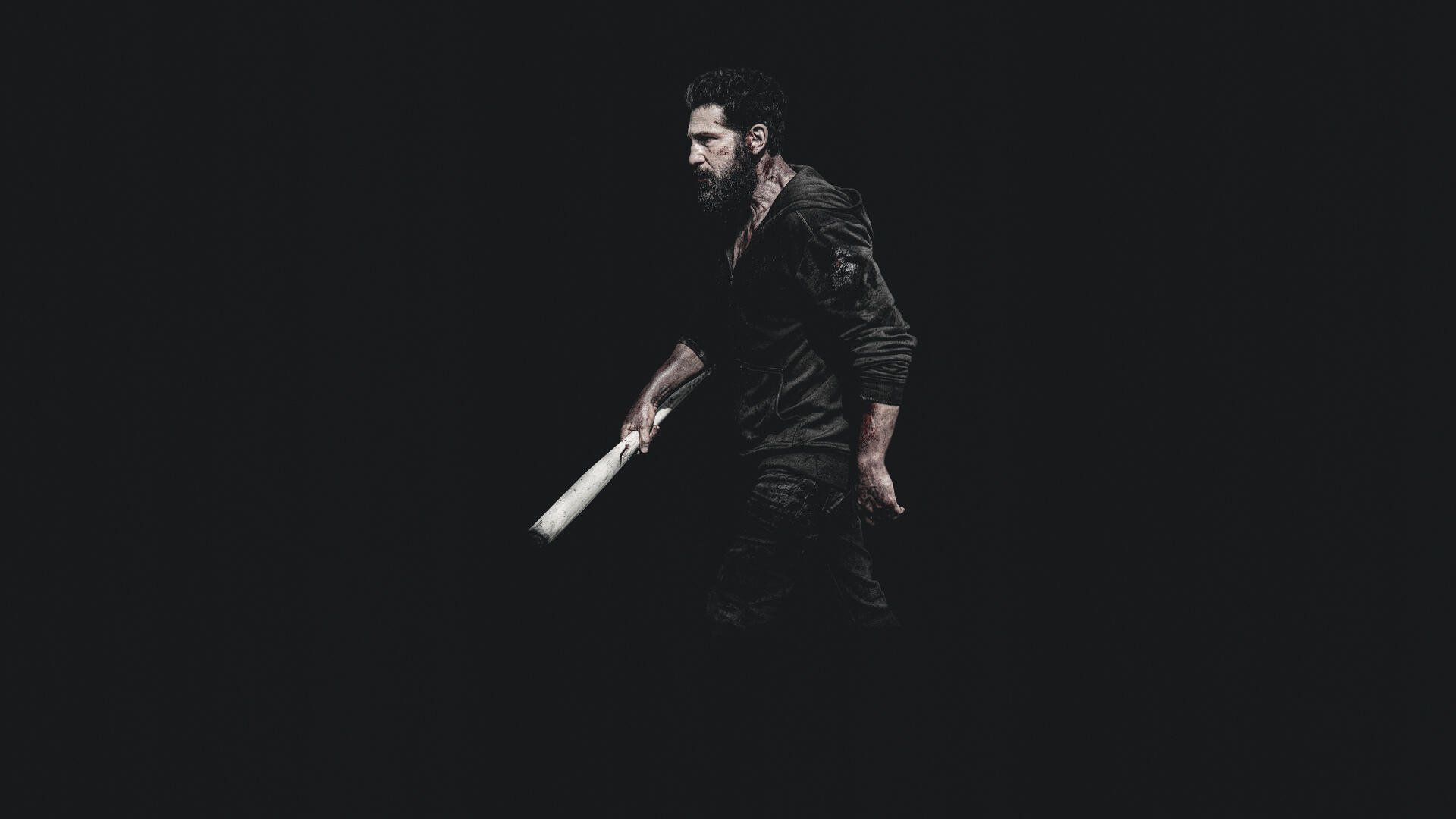 4K Ultra HD PC desktop wallpaper — The Punisher: One Last Kill: lone vigilante in dark clothes gripping a bat, emerging from deep black background.