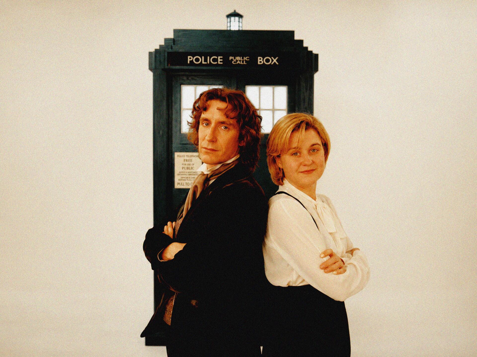 Doctor Who (2005) 4K desktop wallpaper: the Doctor and Charley Pollard stand back-to-back in front of the TARDIS — Big Finish Productions.