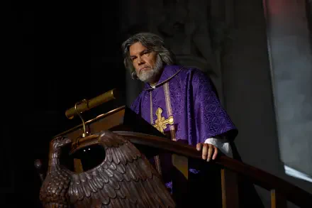 Bearded actor in purple priest robes at a pulpit from the movie Wake Up Dead Man: A Knives Out Mystery — 8K Ultra HD PC desktop wallpaper.