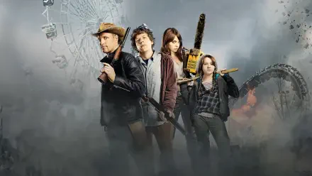 Zombieland film quartet of armed survivors emerging from fog with amusement-park ruins in the background — 4K Ultra HD PC desktop wallpaper/background.
