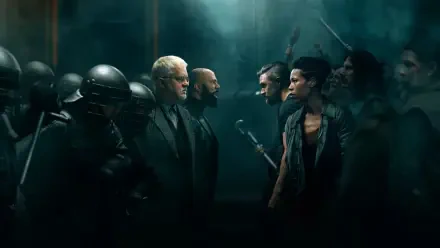 4K Ultra HD PC desktop wallpaper and background: tense standoff in a dim industrial silo — armored police on left confront armed civilians on right beneath a greenish haze.