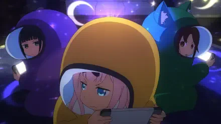 HD PC desktop wallpaper of Chika Fujiwara (Kaguya-sama: Love is War) in a yellow animal costume playing a handheld game, flanked by two friends in purple and green hoodies beneath crescent moons.