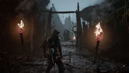 Mortal Shell II video game HD PC desktop wallpaper: armored player walks a rain-soaked ruined village path lit by flaming torches toward a looming enemy.