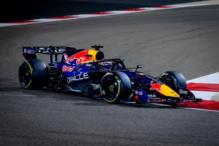 HD PC desktop wallpaper and background of a Red Bull Racing F1 car on track, speeding through a race turn — dynamic racing vehicle with Red Bull livery and sponsor logos.