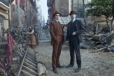 Young Sherlock TV show scene: two young detectives in a Victorian rubble-strewn street, posed for a 2K Quad HD PC desktop wallpaper and background.