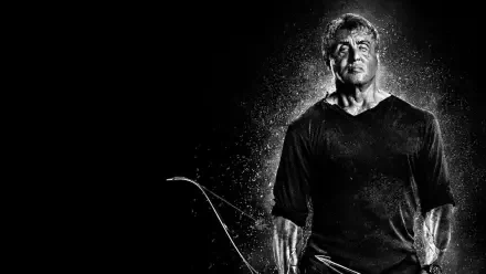 Rambo: Last Blood HD PC desktop wallpaper/background — gritty black-and-white portrait of a lone, battle-worn hero holding a bow, rain and dust highlighting his silhouette.