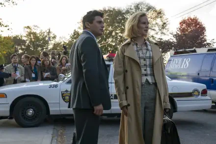 TV show Scarpetta scene with two lead actors by police cars and a gathered crowd in autumn light — 2K Quad HD PC desktop wallpaper/background.