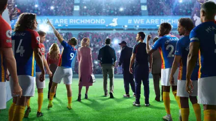 Ted Lasso 4K Ultra HD PC desktop wallpaper: the coach and his squad walk onto a vibrant stadium pitch beneath a WE ARE RICHMOND banner.