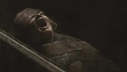 Close-up of a screaming, wrapped corpse from The Mummy in shadowy tones — dramatic 4K Ultra HD PC desktop wallpaper/background.
