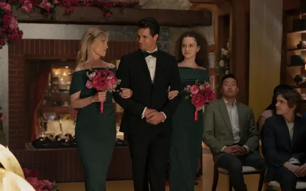 4K Ultra HD PC desktop wallpaper — TV show upload: groom in a tux walks arm-in-arm with two bridesmaids holding pink bouquets during an indoor wedding ceremony.