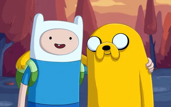 Cartoon HD PC desktop wallpaper: Adventure Time characters Finn and Jake standing arm‑in‑arm, smiling against a warm, stylized forest sunset background.