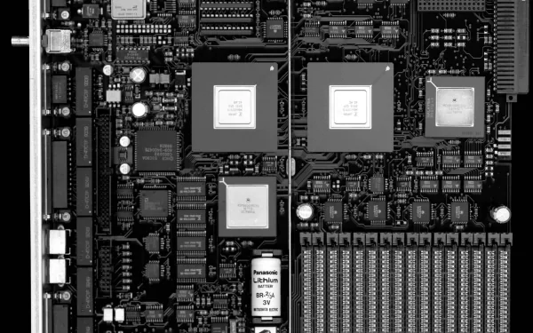 A high-definition desktop wallpaper featuring a detailed close-up of a motherboard, showcasing intricate technology and hardware components.