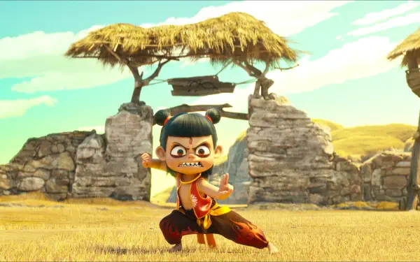 Anime movie wallpaper of Ne Zha striking a martial pose in a sunny grassy field with stone ruins; 2K Quad HD PC desktop background.