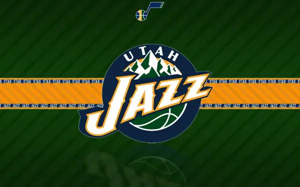 Utah Jazz NBA logo centered on green striped field with an orange horizontal stripe and small team note above — HD PC desktop wallpaper background.