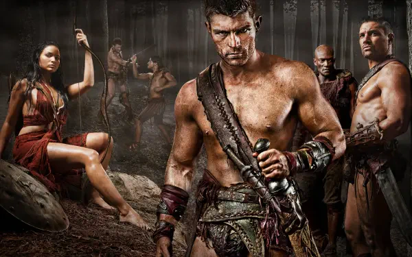 Spartacus: Blood and Sand 4K Ultra HD PC wallpaper — blood-smeared Spartacus grips a sword, flanked by fellow gladiators in a dim, dusty arena.