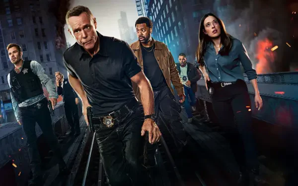 Chicago P.D. 4K Ultra HD PC desktop wallpaper: gritty night city scene of the show's police team striding along train tracks amid smoke and fires.