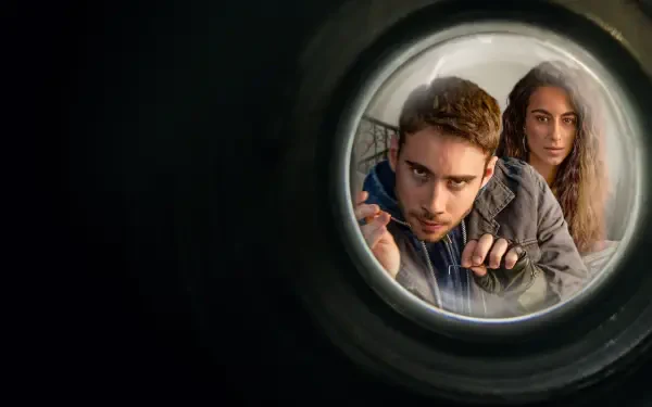 HD PC desktop wallpaper and background: Berlin (La Casa De Papel) and an ally peering through a door peephole, framed by a moody dark vignette.