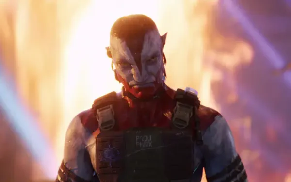 Avatar: Fire and Ash — armored avatar with glowing eyes stands before roaring orange flames, 4K Ultra HD PC desktop wallpaper and background.