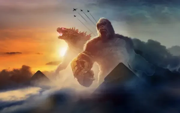 Godzilla x Kong: The New Empire 4K Ultra HD PC wallpaper — towering Kong and roaring Godzilla rise from clouds at sunset, jets streak overhead and pyramid silhouettes dot the horizon.