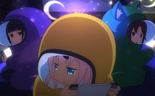 HD PC desktop wallpaper of Chika Fujiwara (Kaguya-sama: Love is War) in a yellow animal costume playing a handheld game, flanked by two friends in purple and green hoodies beneath crescent moons.