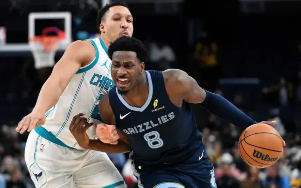 HD NBA desktop wallpaper: Memphis Grizzlies player powering to the basket while a defender reaches in, action-packed court scene.