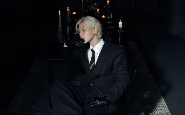 K-pop ATEEZ-inspired portrait — blond figure in a black suit and gloves seated amid gothic candlelight; 4K Ultra HD PC desktop wallpaper/background.