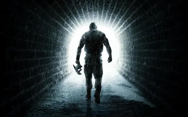 Batman: The Dark Knight Rises — silhouetted Batman strides from a brick tunnel into blinding light, holding a Batarang. 4K Ultra HD PC desktop wallpaper/background.